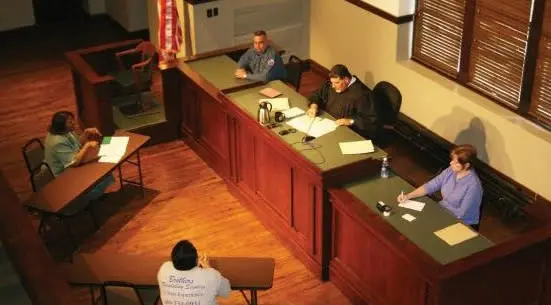Historic Collin County Courthouse judge's bench with Judge Raleeh