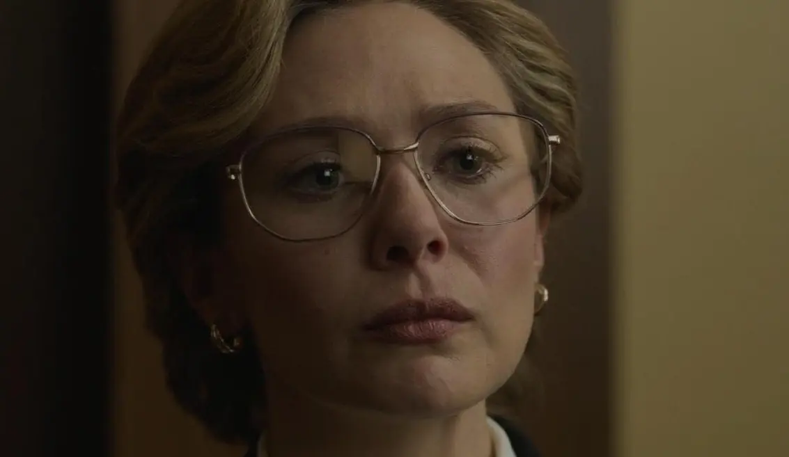 woman in wire framed glasses - serious