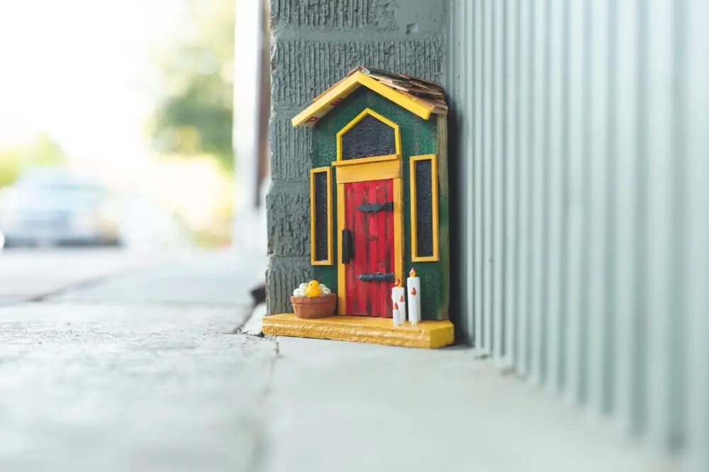 Tiny fairy door on a business