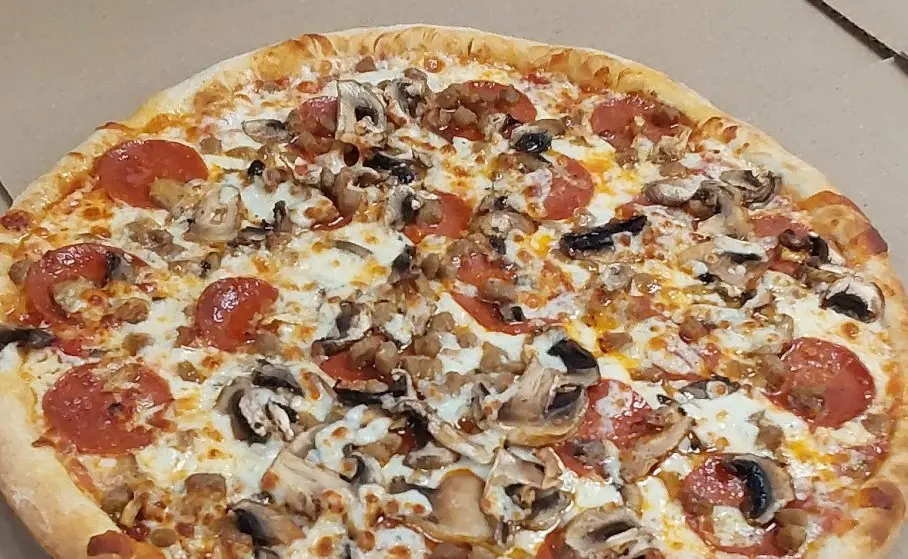 Pizza topped with pepperoni, mushrooms, and cheese