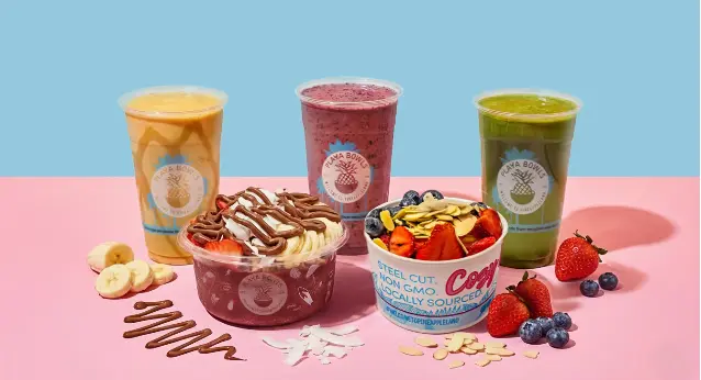 Three colorful drinks and two açai bowls with toppings including granola, berries, and fruit on pink and blue background