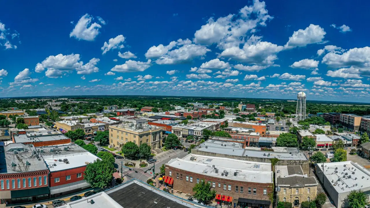 drone shot of downtown McKinney with blue sky and clouds