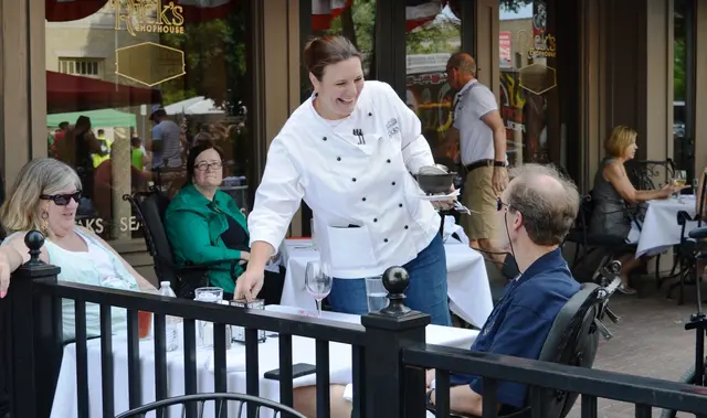 Server placing food on a table