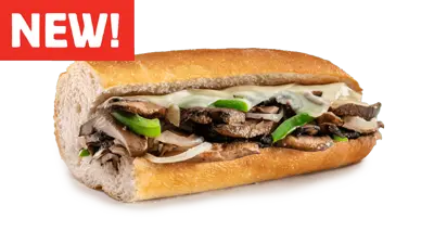 Sliced roast beef, cheese, and green peppers on a toasted sub roll