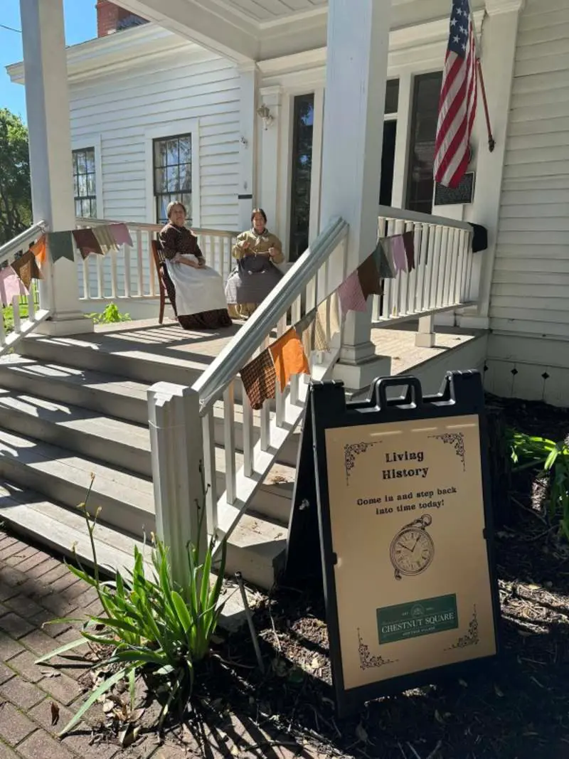 Two women sitting on a porch