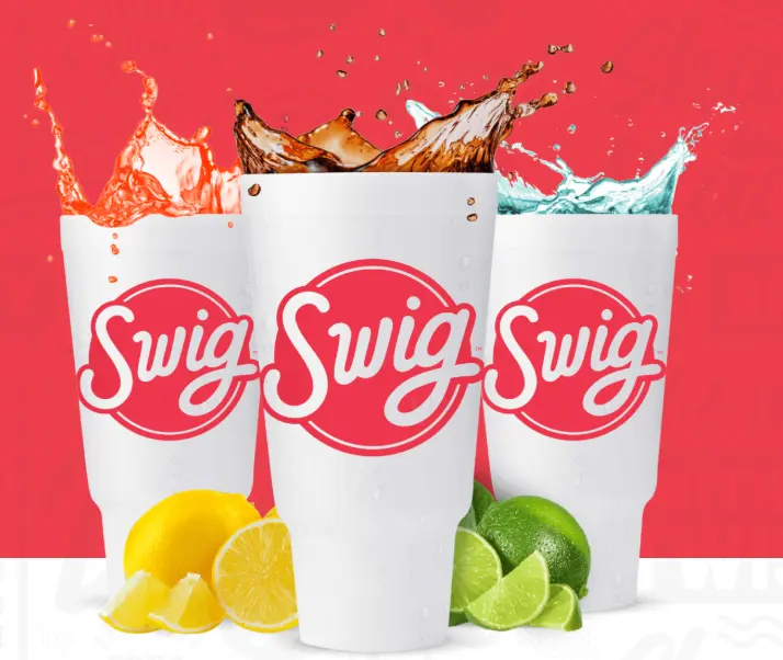 Three white cups with colorful liquid splashing out, lemon slices beside one cup, lime slices beside another, against red background