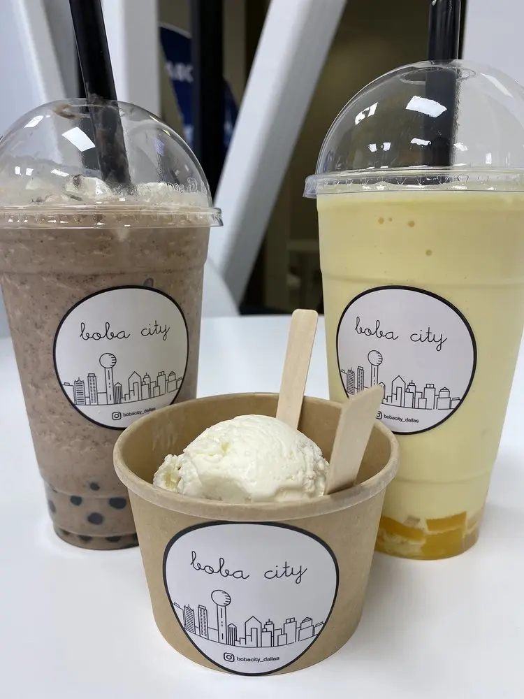 Tapioca pearl drinks in clear cups and vanilla ice cream in a paper cup, all with branded labels