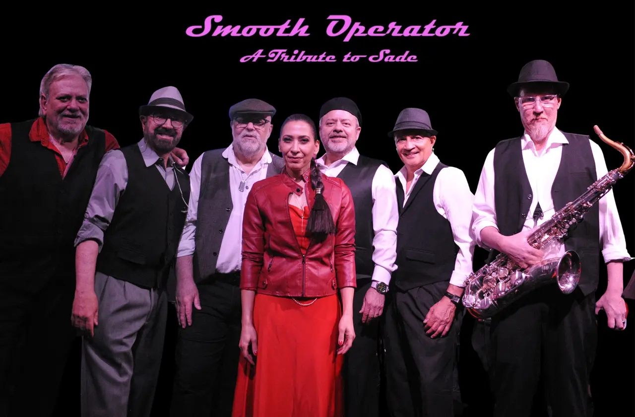 Group of people standing in a line with instruments