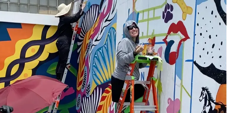 Mural painter at MillHouse McKinney - at the Cotton Mill