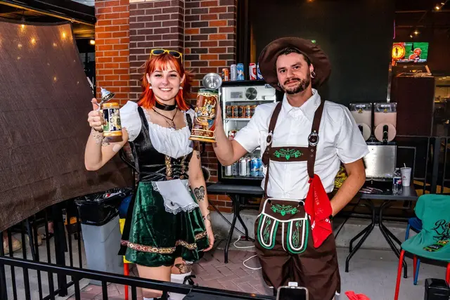 Two people dressed up in Oktoberfest themed outfits