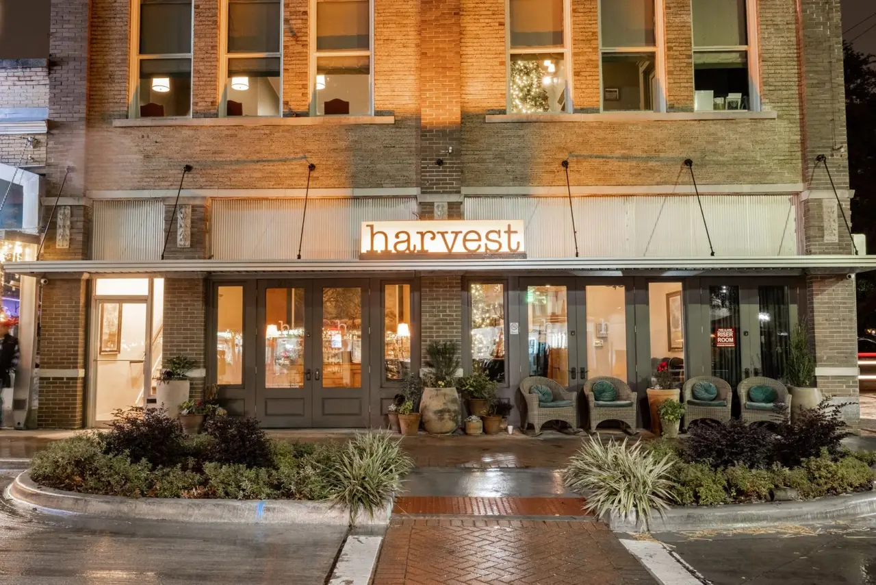 Historic building that has the restaurant Harvest labeled above the door
