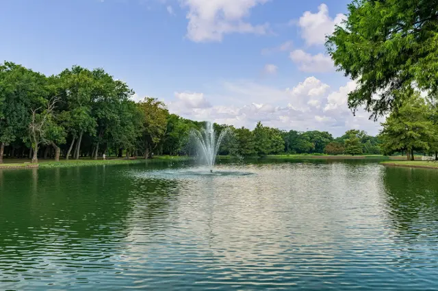 Park with pond in the middle with fountain