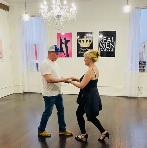 Couple learning to ballroom dance