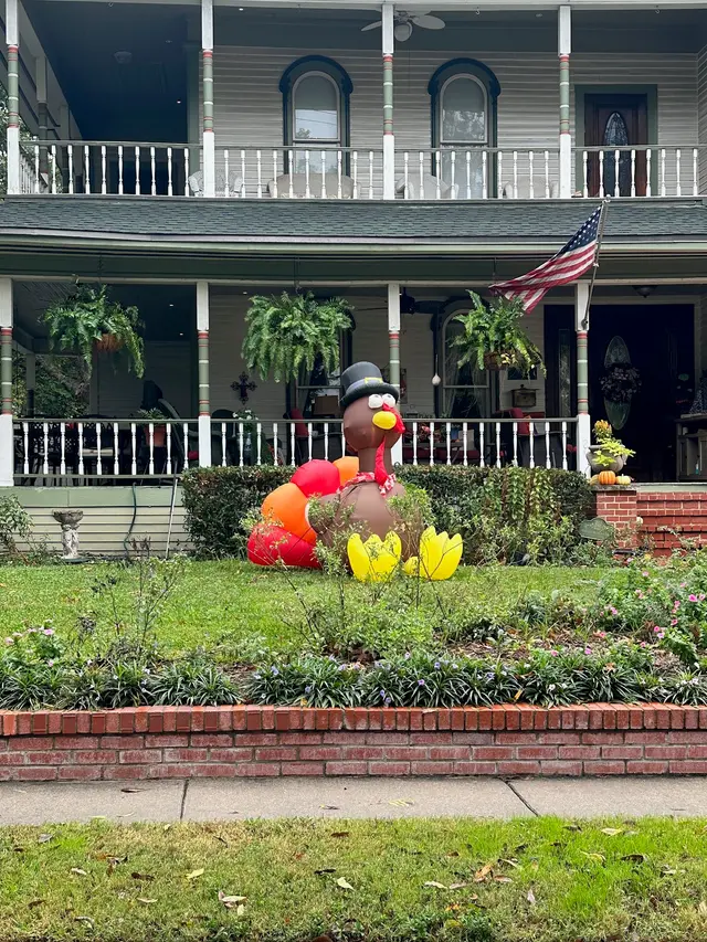 Inflatable turkey in front of a historic home in Downtown McKinney