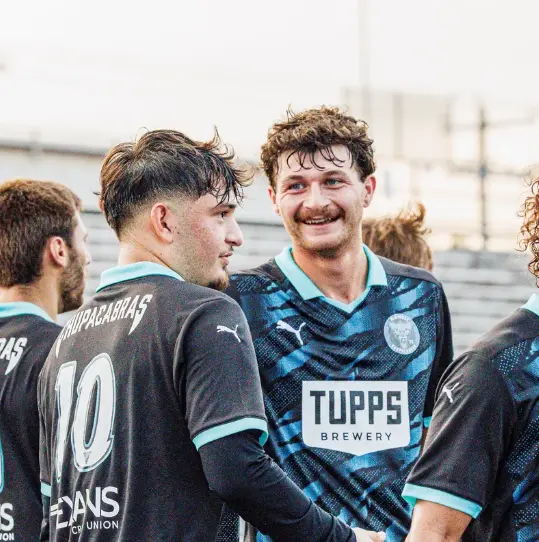 McKinney Chupacabras players in the club's black and teal kit