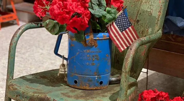 Antiques and geraniums displayed outside a McKinney shop