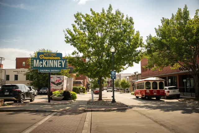 The historic downtown McKinney welcome sign and the trolley