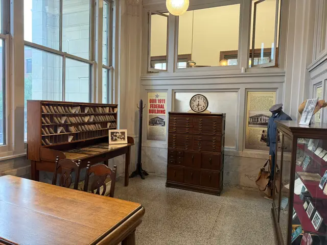 Inside the museum entrance: the old post office sorting desk, a wall clock and the Our 1911 Federal Building exhibit