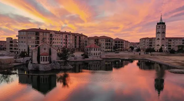 Adriatica's bell tower and harbor at dusk