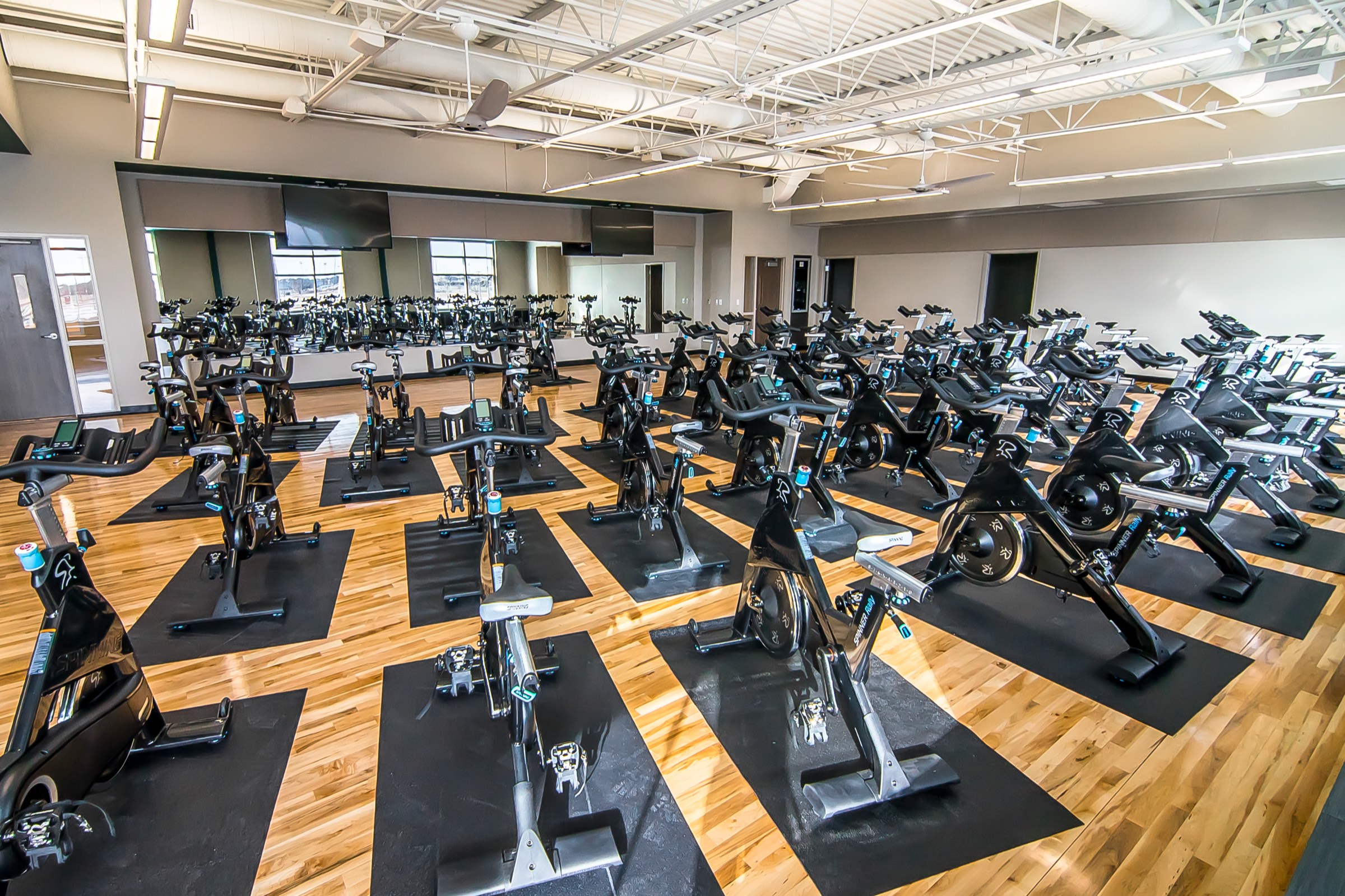 Rows of bikes lined up in a McKinney indoor cycling studio